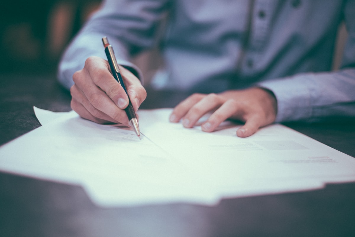 Signing a document with a pen