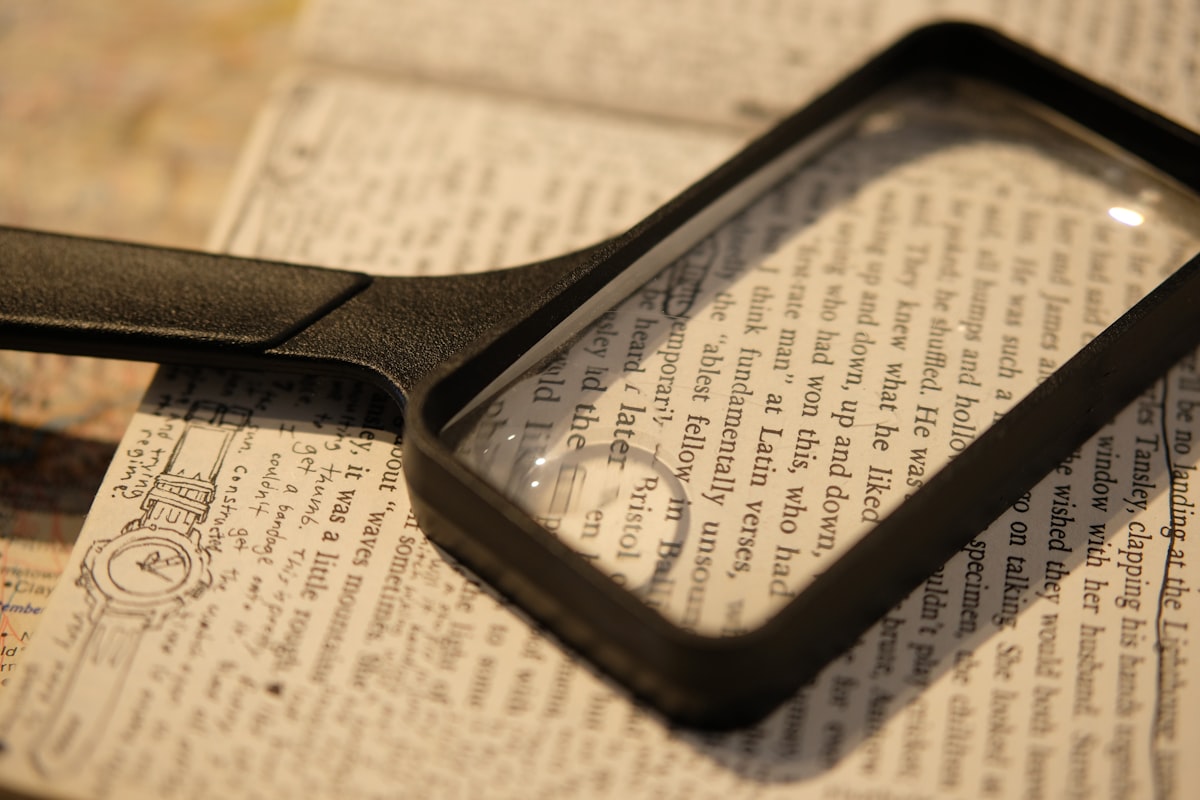 Magnifying glass over a page of printed text